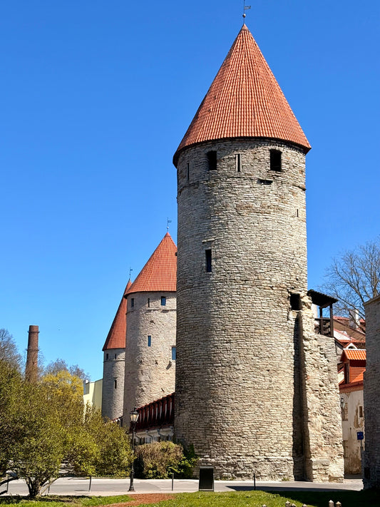 Large stone pillars with red tiled roofs